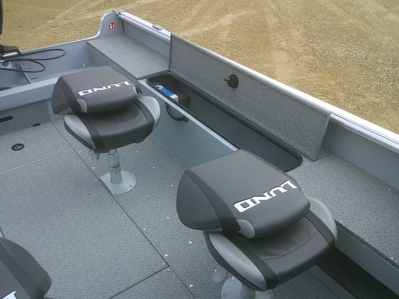 Slide: The Image of 2025 Lund 2075 Alaskan Sport boat interior with two cushioned seats. - 10