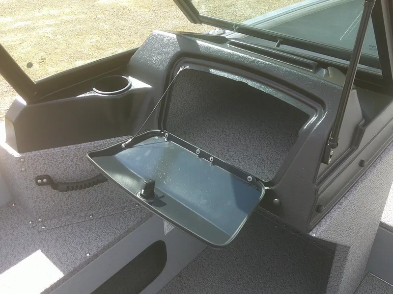 Slide: The Image of 2025 Lund 2075 Alaskan Sport boat interior with open storage compartment. - 14