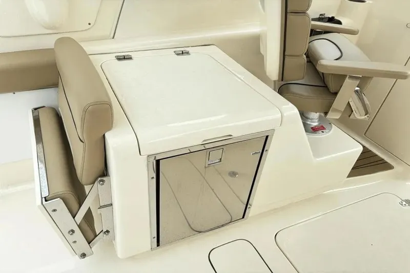 Slide: The Image of 2015 Scout 275 Dorado boat interior with seating and storage compartment. - 22