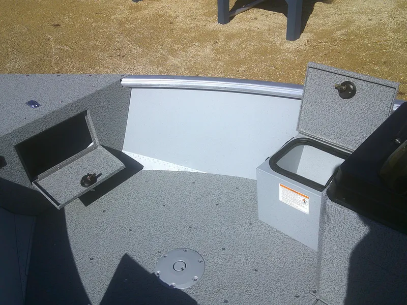 Slide: The Image of 2025 Lund 1675 Alaskan SS boat interior with storage compartments open. - 6