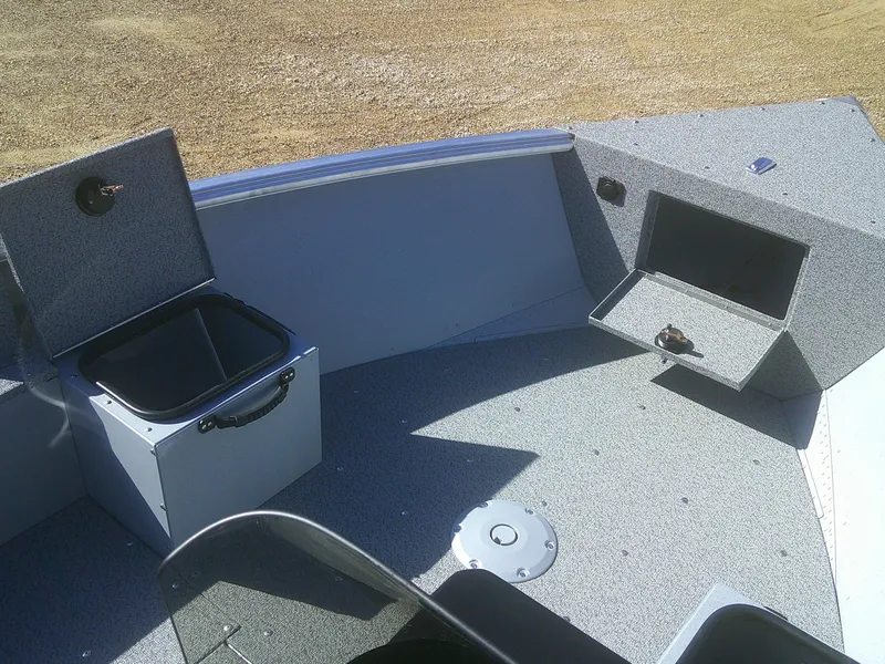 Slide: The Image of 2025 Lund 1675 Alaskan SS boat interior with storage compartments and seating. - 7