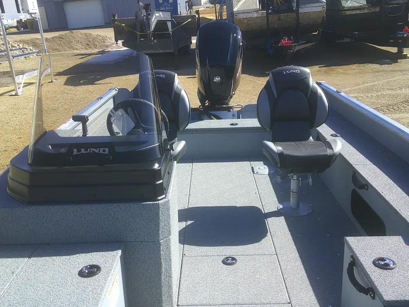 Slide: The Image of 2025 Lund 1675 Alaskan SS boat interior with seating and controls. - 9