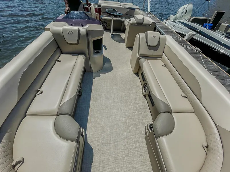 Slide: The Image of 2021 Avalon LSZ 2485 CR pontoon boat interior with beige seating and spacious layout. - 10