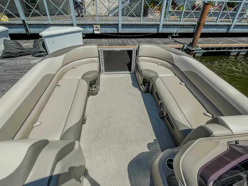 Slide: The Image of 2021 Avalon LSZ 2485 CR pontoon boat interior with spacious seating and modern design. - 11