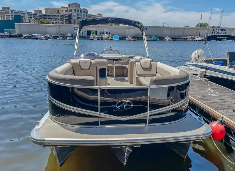 Slide: The Image of 2021 Avalon LSZ 2485 CR pontoon boat docked on a sunny day. - 3