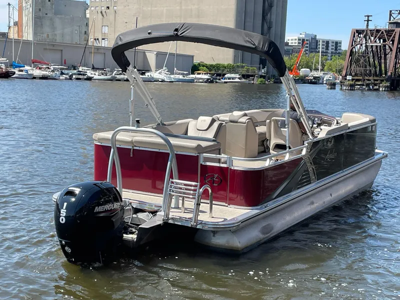 Slide: The Image of 2021 Avalon LSZ 2485 CR pontoon boat with Mercury 150 engine on a sunny day. - 6
