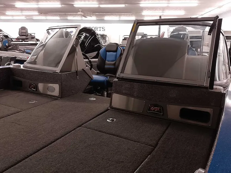 Slide: The Image of 2021 Ranger 622FS Pro boat interior with dual consoles and seating. - 10