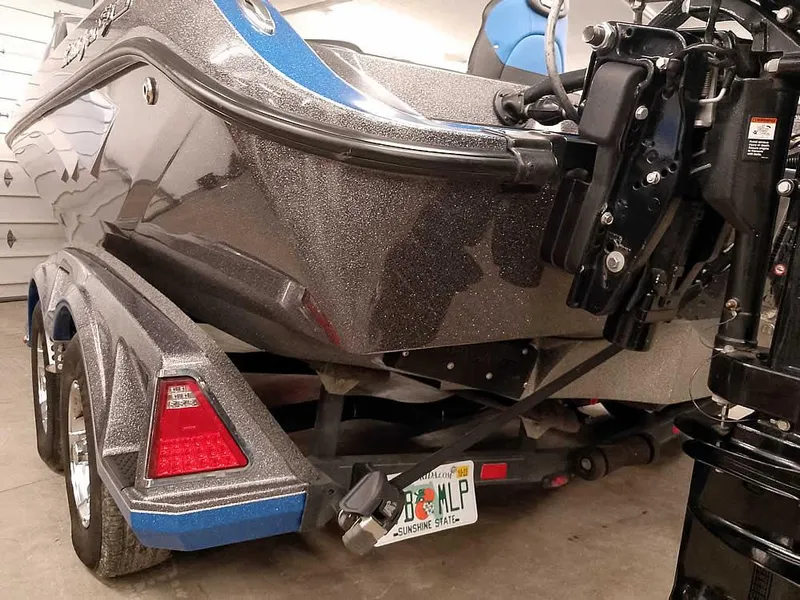 Slide: The Image of 2021 Ranger 622FS Pro boat on trailer, featuring sleek design and metallic finish. - 12