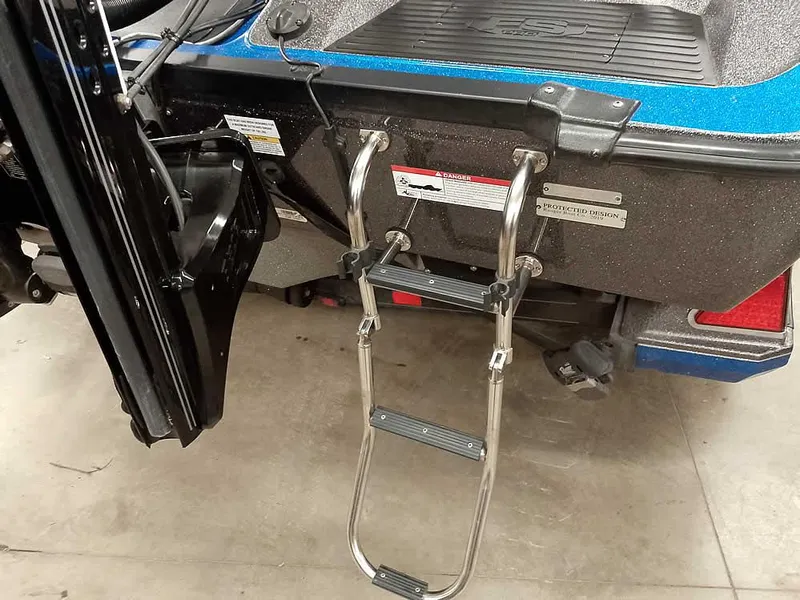 Slide: The Image of 2021 Ranger 622FS Pro boat with a foldable ladder on the stern. - 16