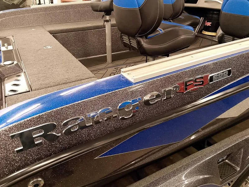 Slide: The Image of 2021 Ranger 622FS Pro boat interior with blue and black seating. - 17