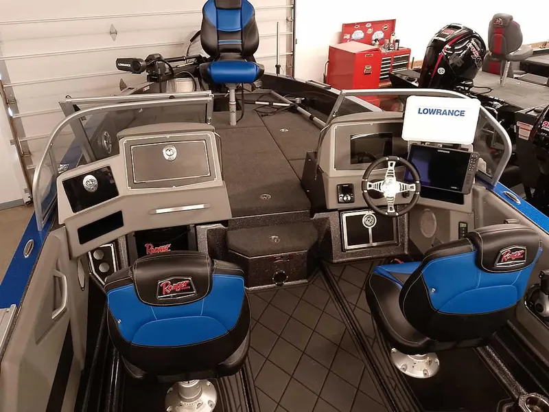 Slide: The Image of 2021 Ranger 622FS Pro boat interior with blue seats and Lowrance electronics. - 18