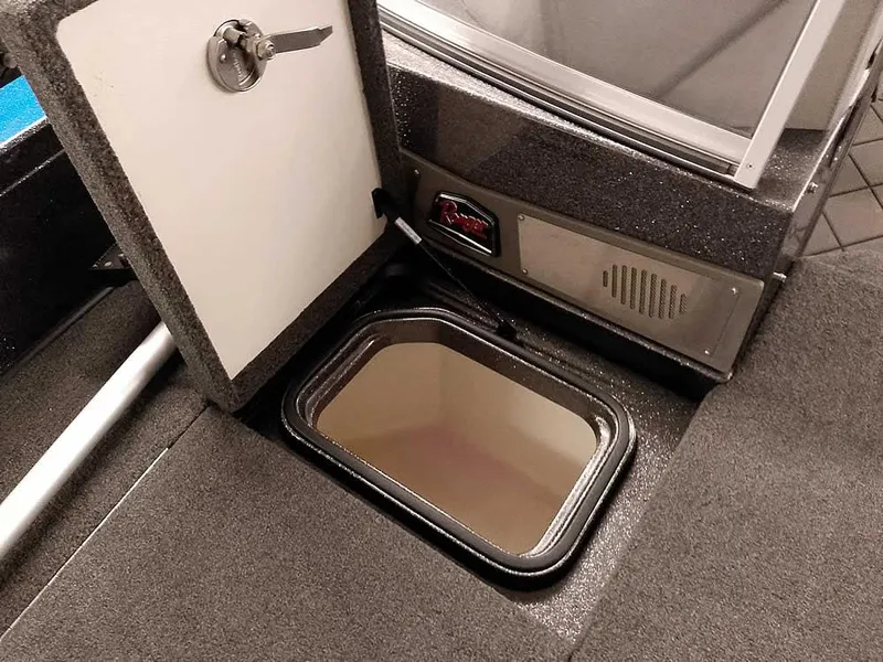 Slide: The Image of 2021 Ranger 622FS Pro boat storage compartment with open hatch, showcasing interior space. - 21