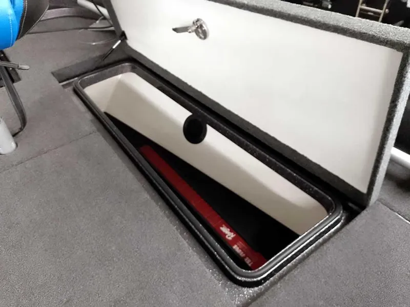 Slide: The Image of 2021 Ranger 622FS Pro boat storage compartment with open lid and secure latch. - 22