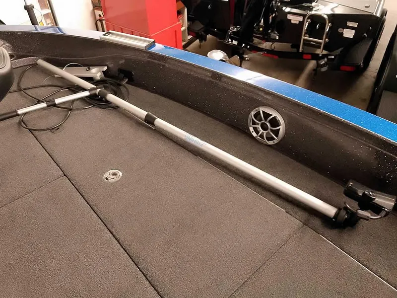 Slide: The Image of 2021 Ranger 622FS Pro boat interior with fishing rod holder and speaker. - 23