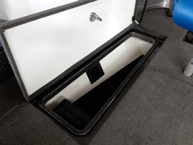Slide: The Image of 2021 Ranger 622FS Pro boat storage compartment with open lid and secure lock. - 24