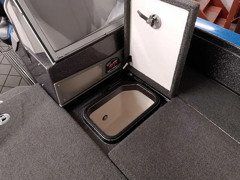 Slide: The Image of 2021 Ranger 622FS Pro boat interior with storage compartment open. - 25