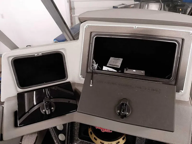Slide: The Image of 2021 Ranger 622FS Pro boat storage compartments, open and closed, showcasing interior space. - 33