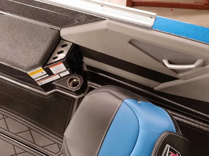 Slide: The Image of Interior of a 2021 Ranger 622FS Pro boat, featuring seating and storage. - 34