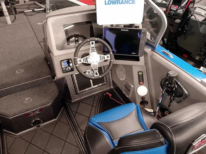 Slide: The Image of 2021 Ranger 622FS Pro boat cockpit with steering wheel and Lowrance electronics. - 36