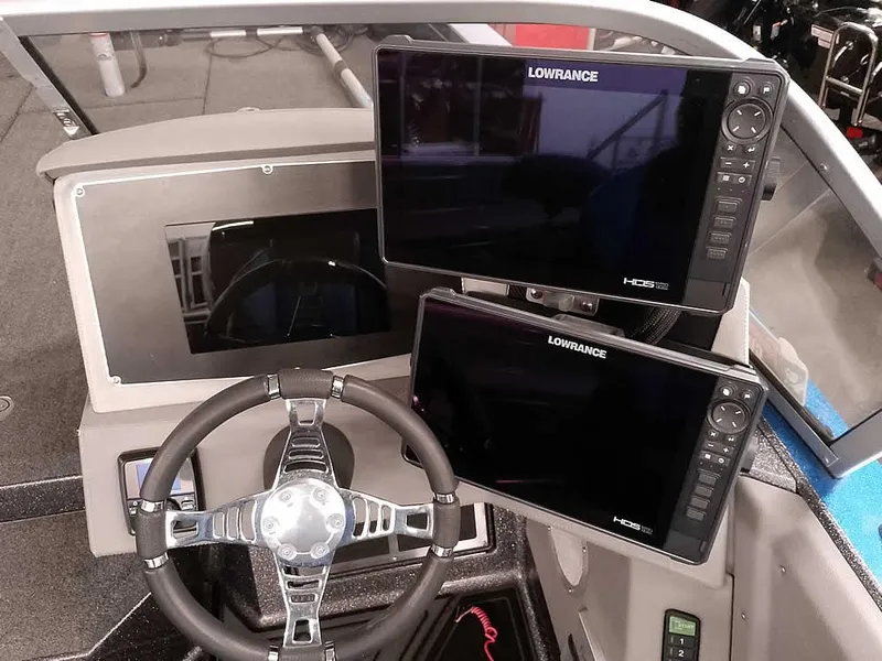 Slide: The Image of 2021 Ranger 622FS Pro boat dashboard with Lowrance HDS displays and steering wheel. - 38