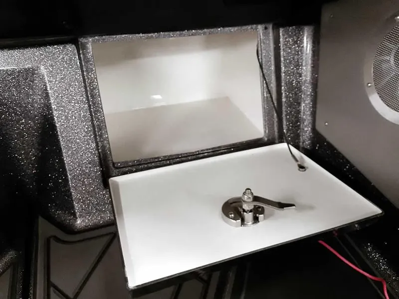 Slide: The Image of 2021 Ranger 622FS Pro boat compartment with latch and wiring. - 39