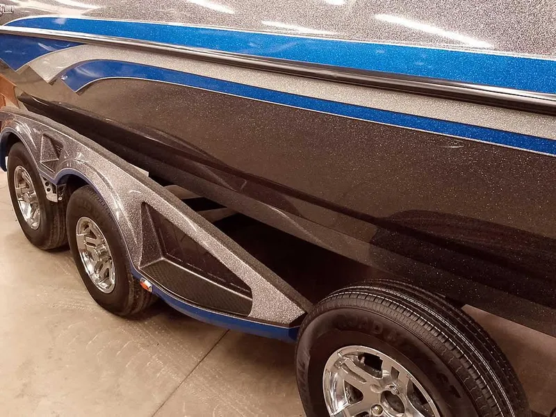 Slide: The Image of 2021 Ranger 622FS Pro boat with sleek design and triple-axle trailer. - 4