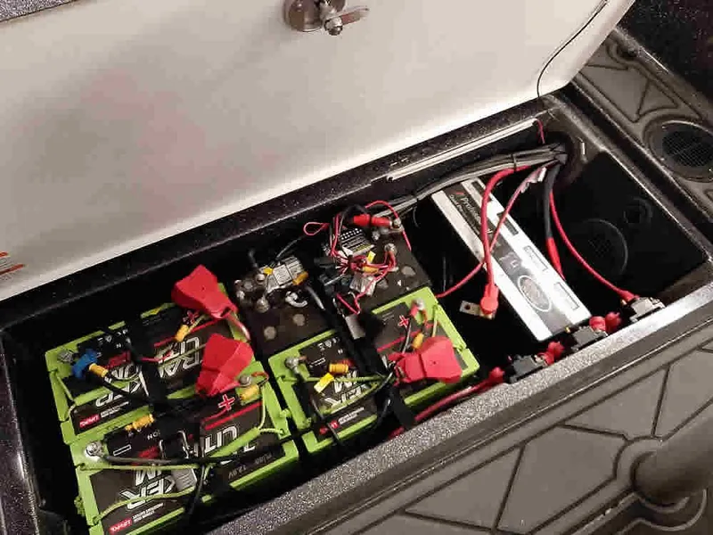 Slide: The Image of Battery compartment of a 2021 Ranger 622FS Pro boat with multiple batteries and wiring. - 40