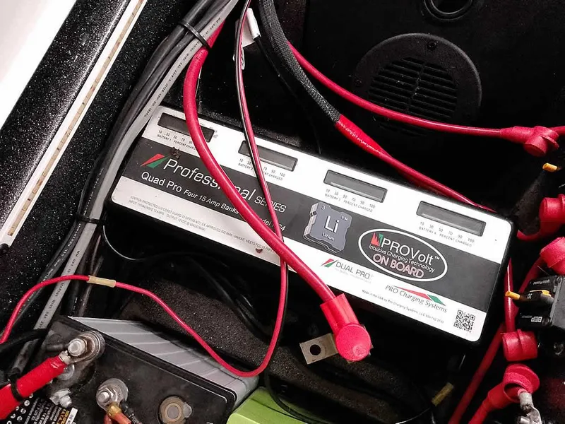 Slide: The Image of Battery compartment of a 2021 Ranger 622FS Pro boat with wiring and charger. - 41