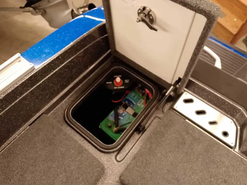 Slide: The Image of 2021 Ranger 622FS Pro boat battery compartment with open hatch. - 46