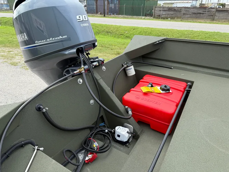 Slide: The Image of 2025 Alweld 1860 SC FLAT boat with Yamaha 90 four-stroke engine and red fuel tank. - 2