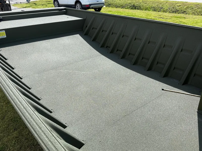 Slide: The Image of 2025 Alweld 1860 SC FLAT boat interior with textured flooring. - 3