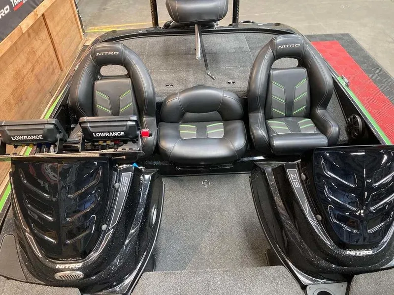 Slide: The Image of 2017 Nitro Z19 boat interior with dual Lowrance fish finders and sleek black seating. - 10