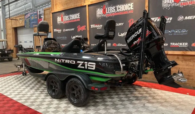 Slide: The Image of 2017 Nitro Z19 boat with Mercury Pro XS engine on display indoors. - 3