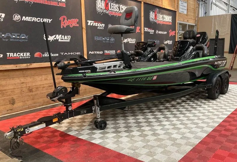 Slide: The Image of 2017 Nitro Z19 boat on display with trailer in showroom setting. - 5