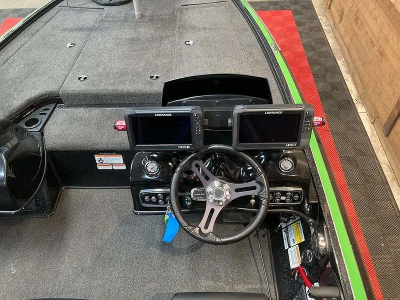 Slide: The Image of 2017 Nitro Z19 boat dashboard with dual Lowrance displays and steering wheel. - 7