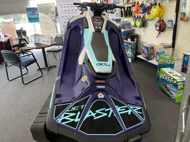 Slide: The Image of 2025 Yamaha WaveRunner JetBlaster LTD displayed in a showroom with accessories. - 2