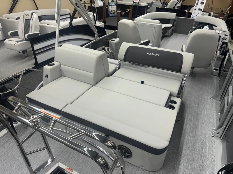 Slide: The Image of 2025 Harris Cruiser 230 pontoon boat with luxurious seating and modern design. - 10