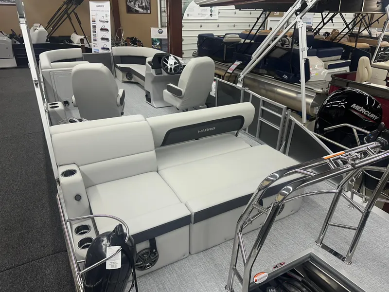 Slide: The Image of 2025 Harris Cruiser 230 pontoon boat interior with plush seating and modern design. - 12