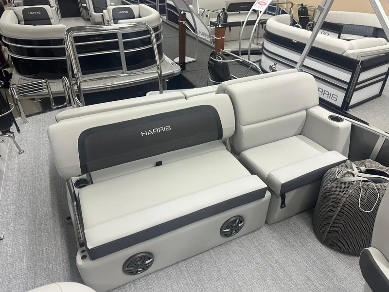 Slide: The Image of 2025 Harris Cruiser 230 boat interior with plush seating and modern design. - 9