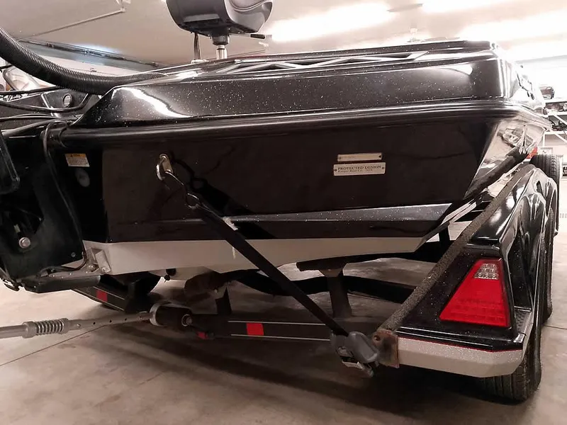 Slide: The Image of 2019 Ranger Z519 DC boat on trailer in garage setting. - 14