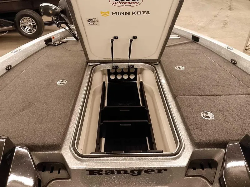 Slide: The Image of 2019 Ranger Z519 DC boat with open storage compartment, featuring Minn Kota and Driftmaster branding. - 17