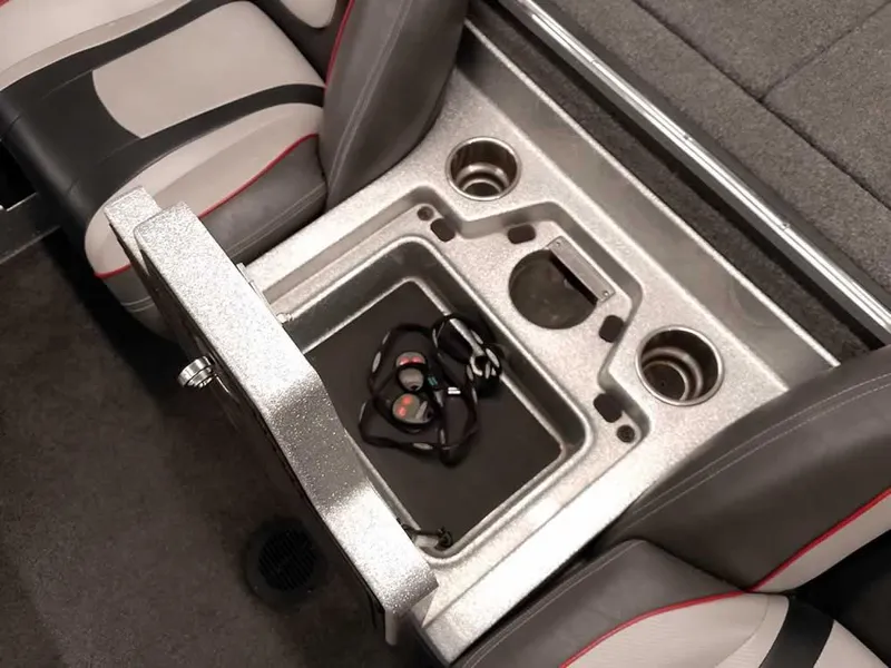 Slide: The Image of 2019 Ranger Z519 DC boat interior with storage compartment and cup holders. - 25