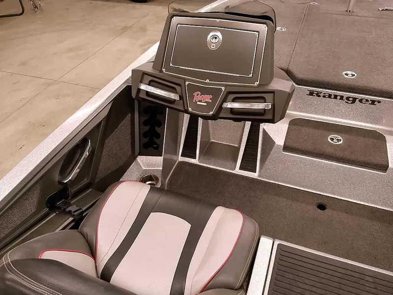 Slide: The Image of 2019 Ranger Z519 DC boat interior with seating and storage compartments. - 26