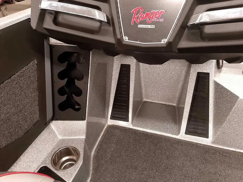 Slide: The Image of 2019 Ranger Z519 DC boat interior with cup holder and storage compartments. - 27