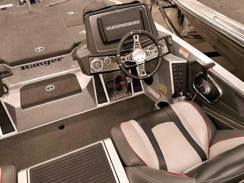 Slide: The Image of 2019 Ranger Z519 DC boat cockpit with steering wheel and Humminbird display. - 30