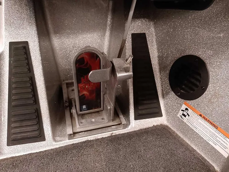 Slide: The Image of 2019 Ranger Z519 DC boat foot pedal and control panel close-up. - 31