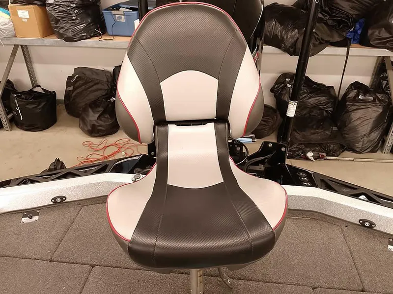 Slide: The Image of 2019 Ranger Z519 DC boat seat, black and gray design, in a workshop setting. - 36