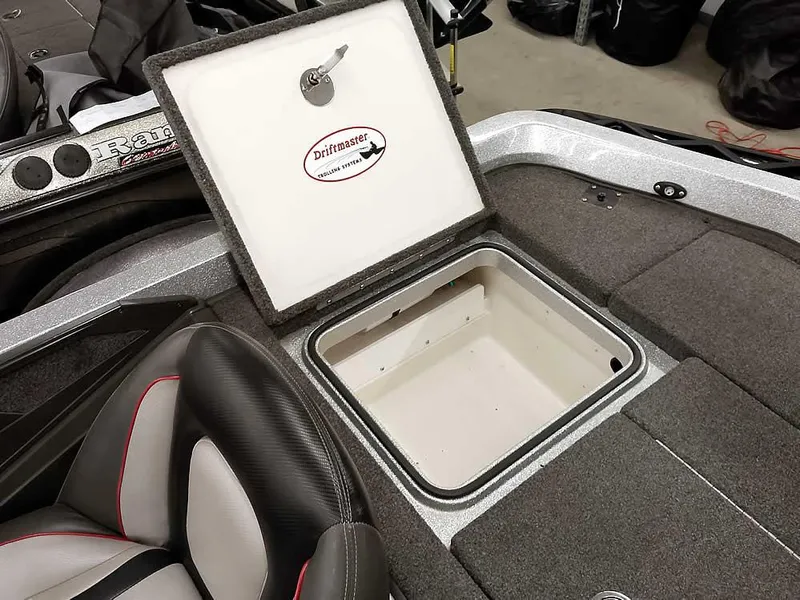 Slide: The Image of 2019 Ranger Z519 DC boat storage compartment with open lid, showcasing interior space. - 37