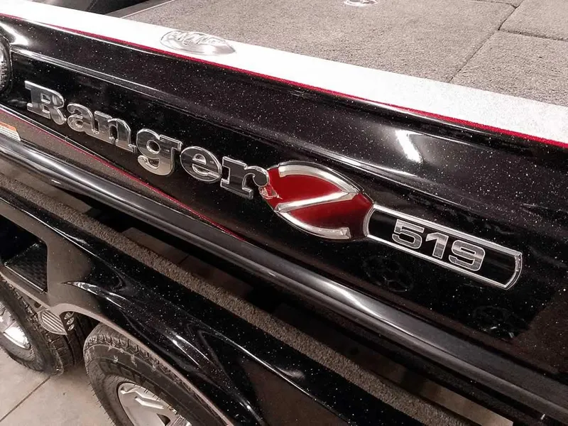 Slide: The Image of 2019 Ranger Z519 DC boat, black exterior with logo detail. - 4