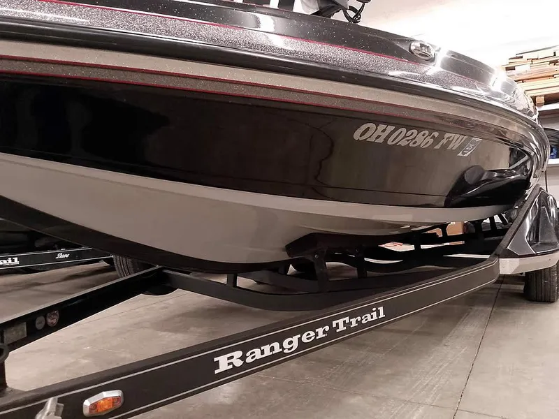 Slide: The Image of 2019 Ranger Z519 DC boat on Ranger Trail trailer in a garage. - 5